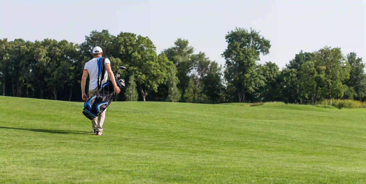 golfer-with-golf-bag-walking-down-course